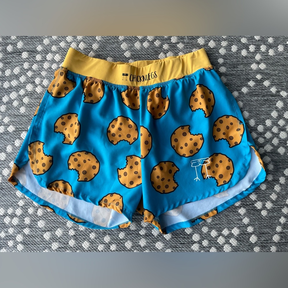 CHICKNLEGS running shorts Men’s 4” inseam 
Medium chocolate chip cookies cookie